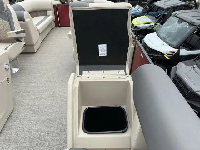 Slide: The Image of 2024 Bennington 22 SSR Tri-Toon Pontoon interior with open storage compartment. - 21