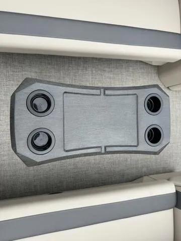 Slide: The Image of 2024 Bennington 22 SSR Tri-Toon Pontoon cup holder and table detail. - 24