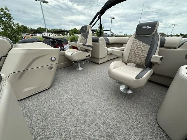 Slide: The Image of 2024 Bennington 22 SSR Tri-Toon Pontoon interior with luxurious seating and modern design. - 25