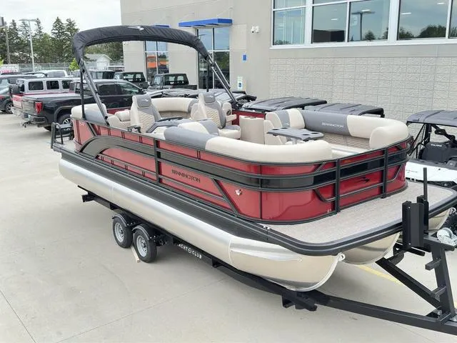 Slide: The Image of 2024 Bennington 22 SSR Tri-Toon Pontoon boat on trailer, red and beige design. - 3