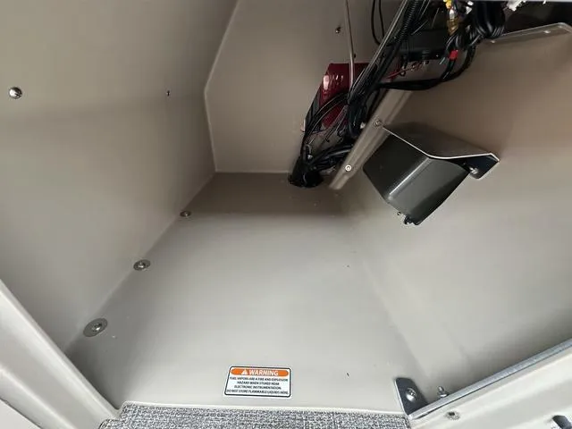 Slide: The Image of 2024 Bennington 22 SSR Tri-Toon Pontoon storage compartment interior view. - 30