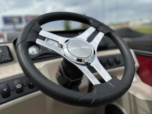Slide: The Image of Steering wheel of 2024 Bennington 22 SSR Tri-Toon Pontoon boat, close-up view. - 35