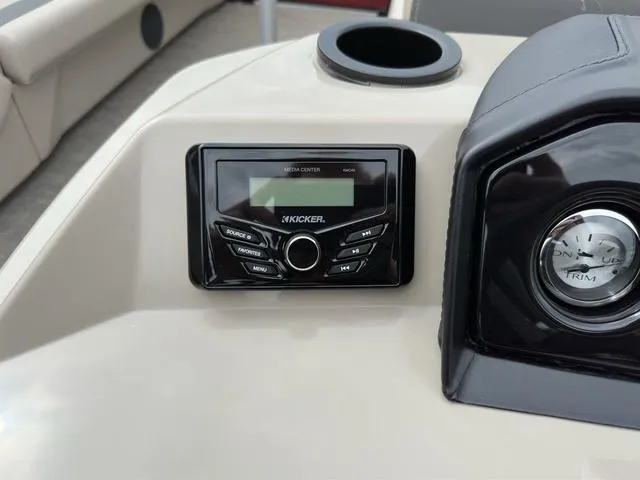 Slide: The Image of 2024 Bennington 22 SSR Tri-Toon Pontoon dashboard with Kicker media center and trim gauge. - 39