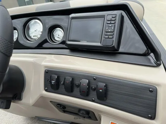 Slide: The Image of Dashboard of 2024 Bennington 22 SSR Tri-Toon Pontoon with gauges and Garmin display. - 41