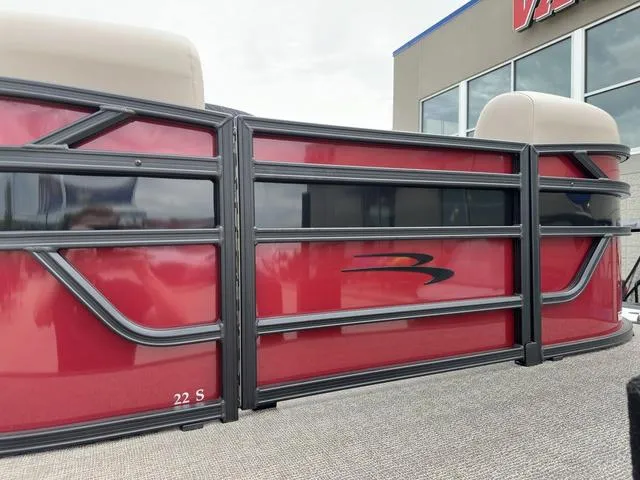 Slide: The Image of 2024 Bennington 22 SSR Tri-Toon Pontoon with red exterior and sleek design. - 5