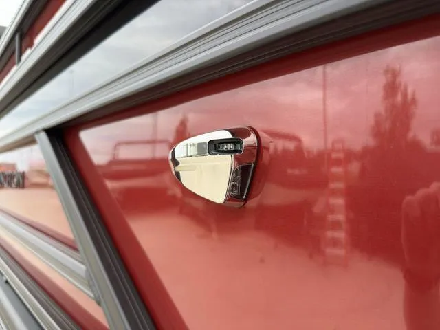 Slide: The Image of 2024 Bennington 22 SSR Tri-Toon Pontoon, red exterior detail with chrome accent. - 6
