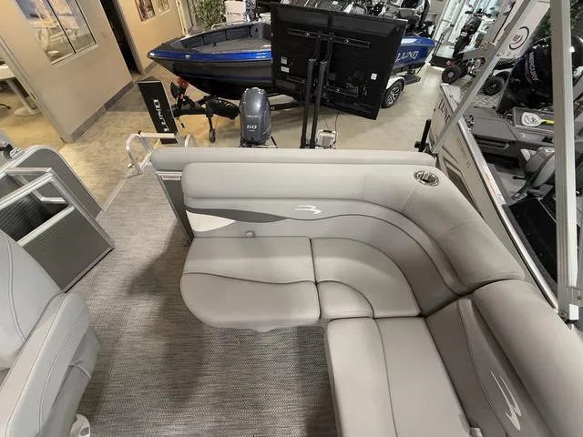 Slide: The Image of 2024 Bennington 208SLJ pontoon boat interior with gray seating and modern design. - 19