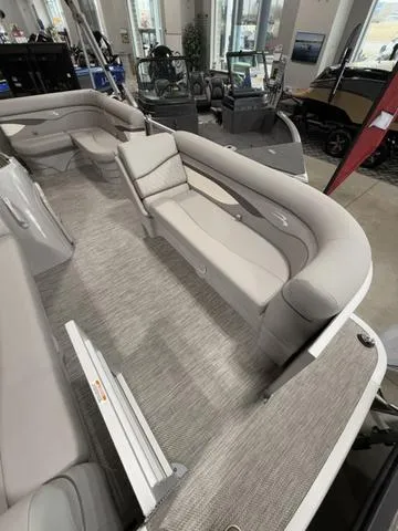 Slide: The Image of 2024 Bennington 208SLJ pontoon boat interior with plush seating and modern design. - 4
