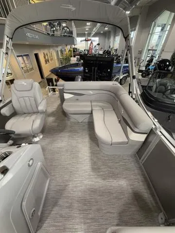 Slide: The Image of 2024 Bennington 208SLJ pontoon boat interior with gray seating and modern design. - 8