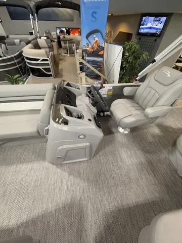 Slide: The Image of 2024 Bennington 208SLJ boat interior with modern helm and comfortable seating. - 9