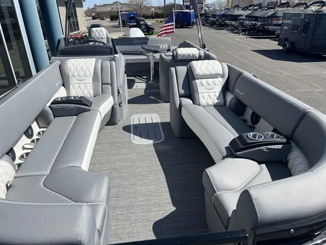 Slide: The Image of 2024 Bennington 25RX Swingback ESP Tri-Toon Pontoon with luxurious gray seating and spacious layout. - 10
