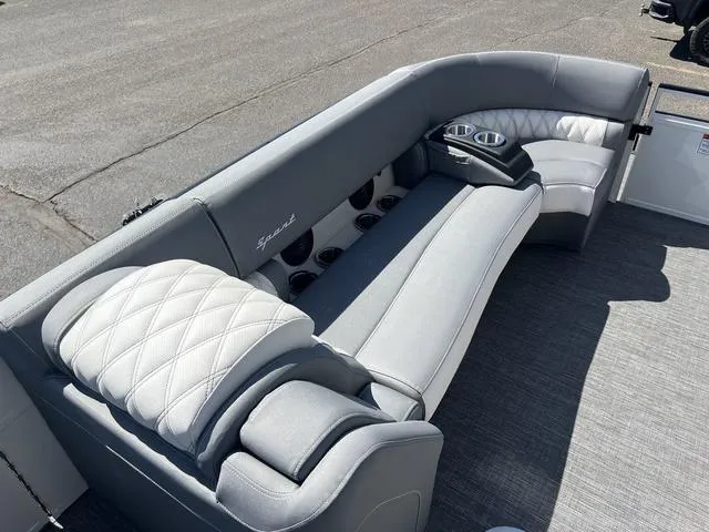 Slide: The Image of 2024 Bennington 25RX Swingback ESP Tri-Toon Pontoon with luxurious seating and cup holders. - 11