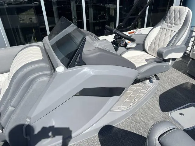 Slide: The Image of 2024 Bennington 25RX Swingback ESP Tri-Toon Pontoon helm with luxurious seating and modern controls. - 14