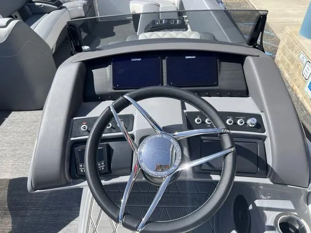 Slide: The Image of 2024 Bennington 25RX Swingback ESP Tri-Toon Pontoon dashboard with dual Simrad displays. - 15