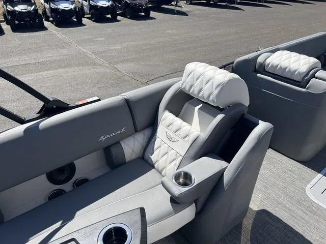 Slide: The Image of 2024 Bennington 25RX Swingback ESP Tri-Toon Pontoon with luxurious seating and cup holders. - 19