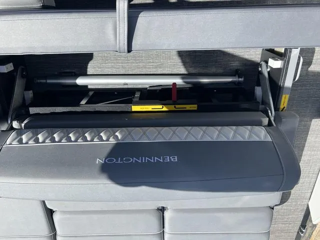 Slide: The Image of 2024 Bennington 25RX Swingback ESP Tri-Toon Pontoon seating with storage compartment. - 22