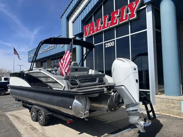 Slide: The Image of 2024 Bennington 25RX Swingback ESP Tri-Toon Pontoon displayed outside Vallely dealership. - 3