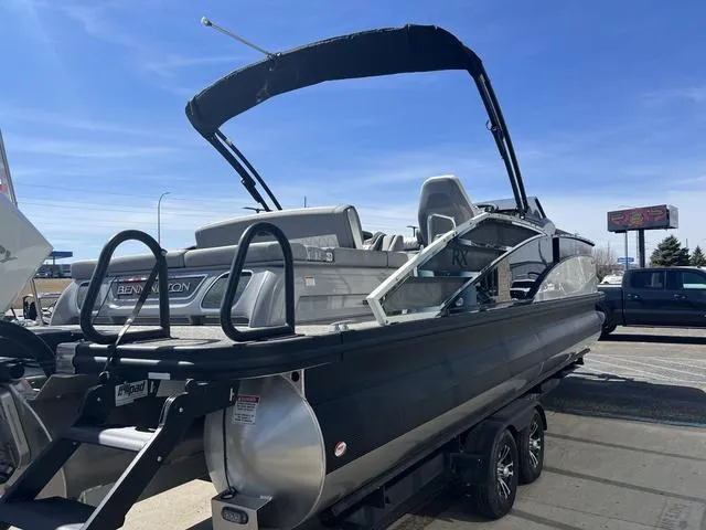 Slide: The Image of 2024 Bennington 25RX Swingback ESP Tri-Toon Pontoon with black exterior on trailer. - 7