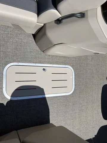 Slide: The Image of 2024 Bennington 22SSB-SPS boat interior with gray flooring and seating. - 15