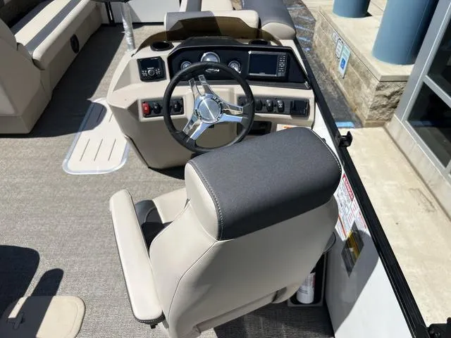 Slide: The Image of 2024 Bennington 22SSB-SPS boat interior with steering wheel and control panel. - 17