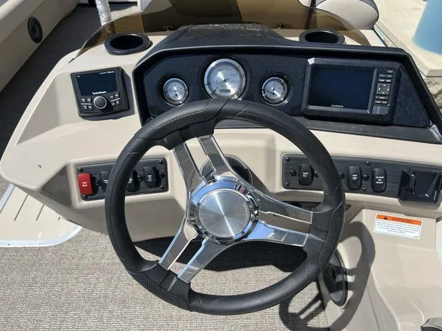 Slide: The Image of Steering console of 2024 Bennington 22SSB-SPS boat with gauges and controls. - 18