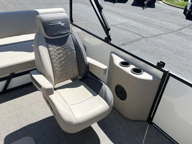 Slide: The Image of 2024 Bennington 22SSB-SPS boat interior with luxury seating and cup holders. - 19