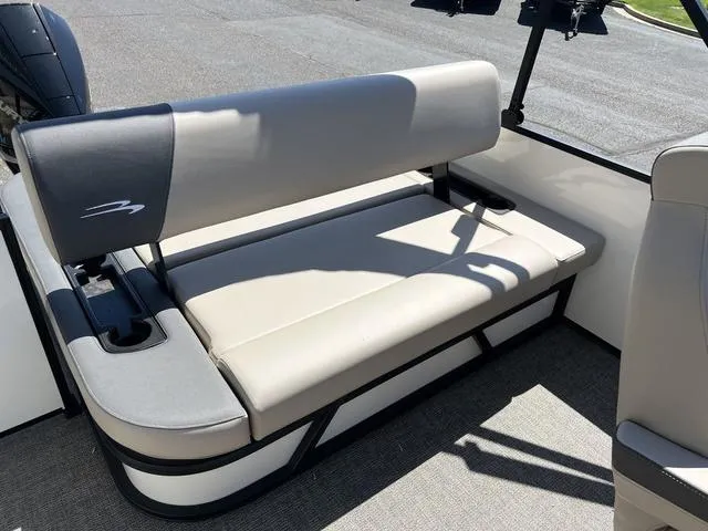 Slide: The Image of 2024 Bennington 22SSB-SPS boat seat with beige upholstery and cup holder. - 21