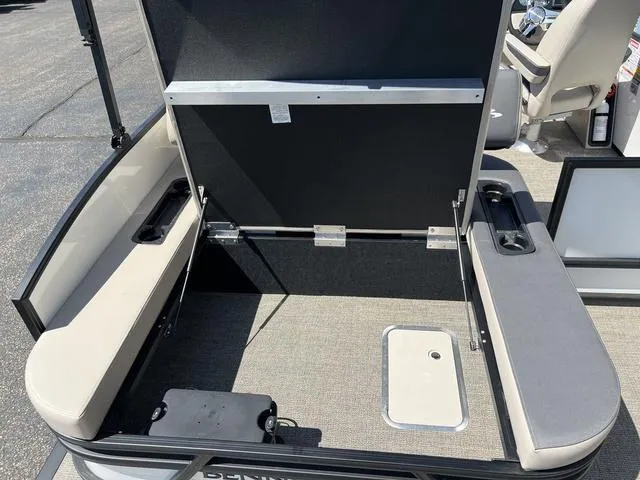 Slide: The Image of 2024 Bennington 22SSB-SPS pontoon boat interior with open storage compartment. - 23