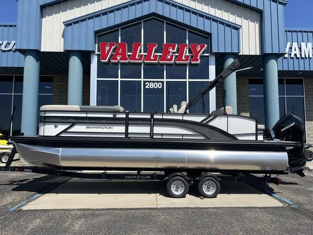 Slide: The Image of 2024 Bennington 22SSB-SPS pontoon boat on trailer outside Vallely dealership. - 3