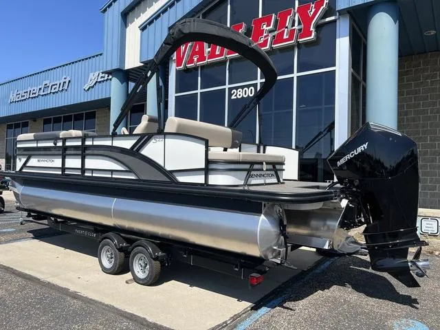 Slide: The Image of 2024 Bennington 22SSB-SPS pontoon boat on trailer outside dealership. - 4