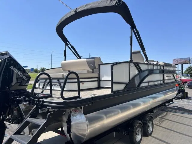 Slide: The Image of 2024 Bennington 22SSB-SPS pontoon boat with Mercury engine on trailer. - 7