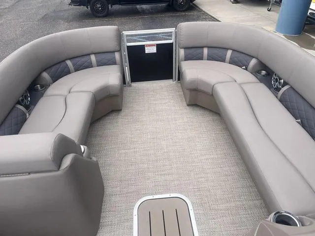 Slide: The Image of 2019 Bennington 23 SSBXP pontoon boat interior with plush seating and modern design. - 13