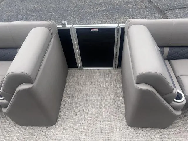 Slide: The Image of 2019 Bennington 23 SSBXP boat interior with gray seating and carpeted flooring. - 17