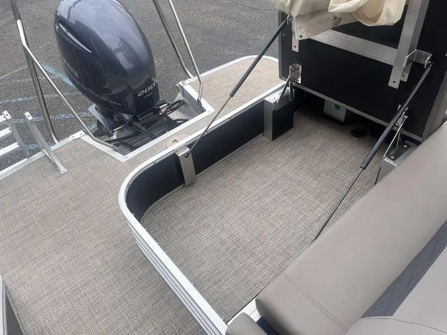 Slide: The Image of 2019 Bennington 23 SSBXP pontoon boat with Yamaha outboard motor, spacious deck area. - 21