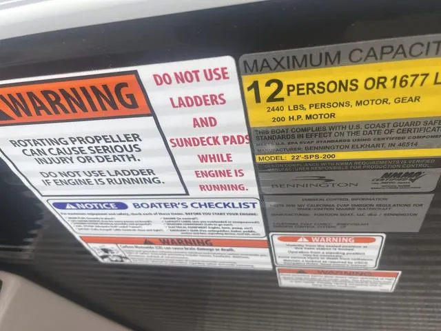 Slide: The Image of Warning labels on a 2019 Bennington 23 SSBXP boat, highlighting safety and capacity information. - 30