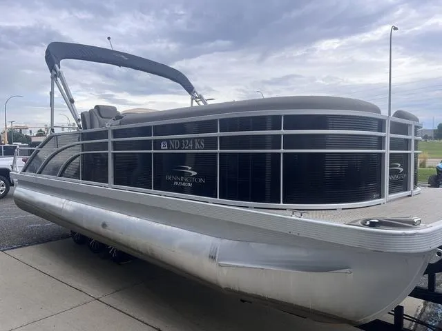 Slide: The Image of 2019 Bennington 23 SSBXP pontoon boat on trailer, parked outdoors. - 4