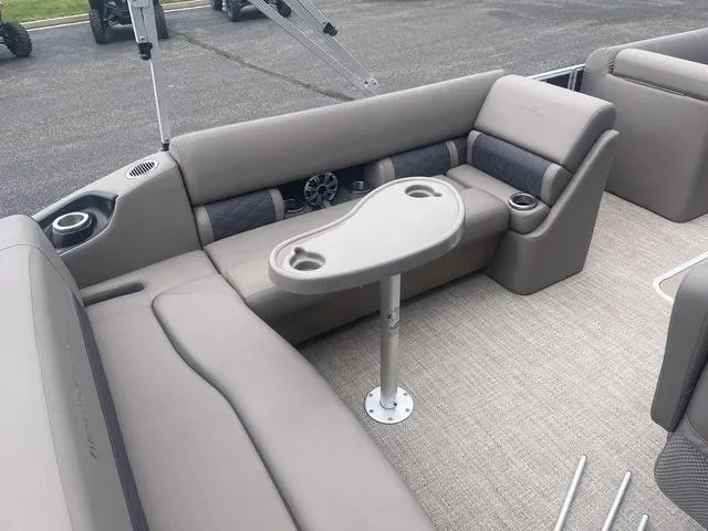 Slide: The Image of 2019 Bennington 23 SSBXP pontoon boat interior with gray seating and table. - 9