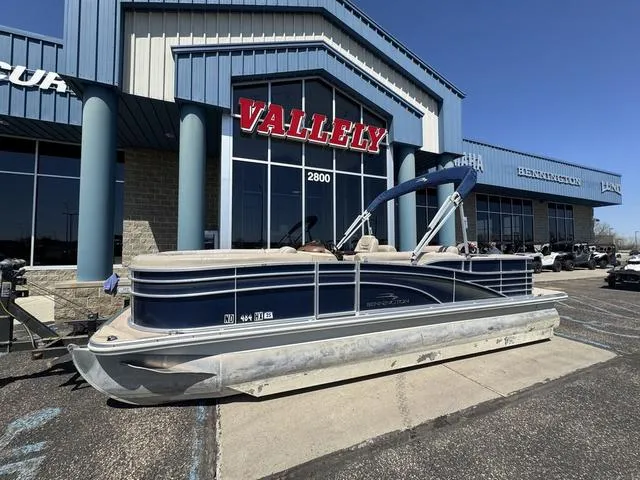 Slide: The Image of 2010 Bennington 2250RCW Pontoon boat parked outside Vallely dealership. - 1