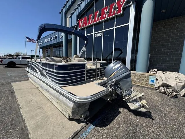 Slide: The Image of 2010 Bennington 2250RCW Pontoon boat with Yamaha motor outside dealership. - 13
