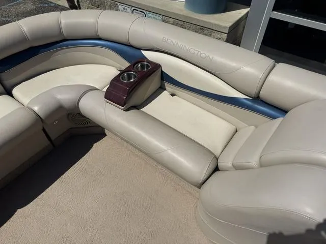 Slide: The Image of Luxurious seating on a 2010 Bennington 2250RCW Pontoon with cup holders and elegant design. - 31