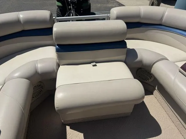 Slide: The Image of 2010 Bennington 2250RCW Pontoon boat seating area with beige and blue upholstery. - 32