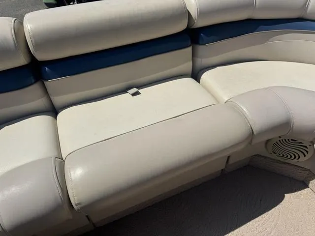Slide: The Image of 2010 Bennington 2250RCW Pontoon boat seating with beige and blue upholstery. - 33