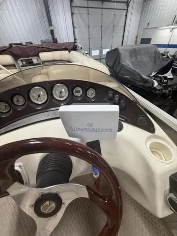 Slide: The Image of 2005 Bennington 2575RLX Pontoon dashboard with Lowrance device in a garage setting. - 10