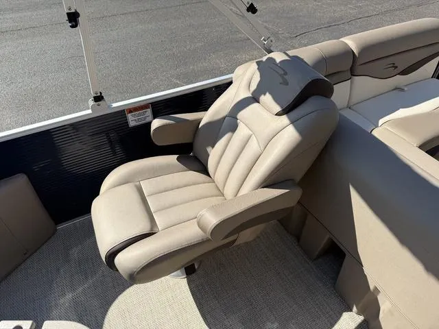 Slide: The Image of Luxurious beige captain's chair on 2019 Bennington 21 SSX pontoon boat. - 12