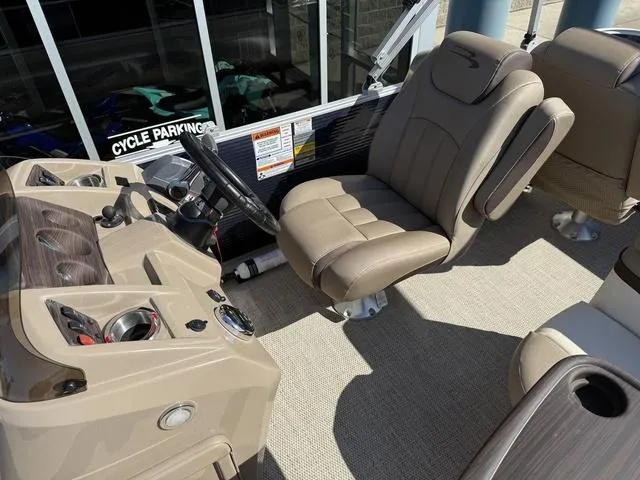 Slide: The Image of 2019 Bennington 21 SSX boat interior with captain's chair and control panel. - 20
