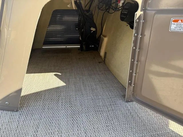 Slide: The Image of Interior view of a 2019 Bennington 21 SSX boat storage compartment. - 28