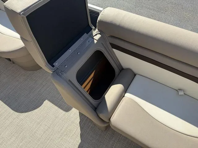Slide: The Image of 2019 Bennington 21 SSX boat seat with open storage compartment, beige upholstery. - 30