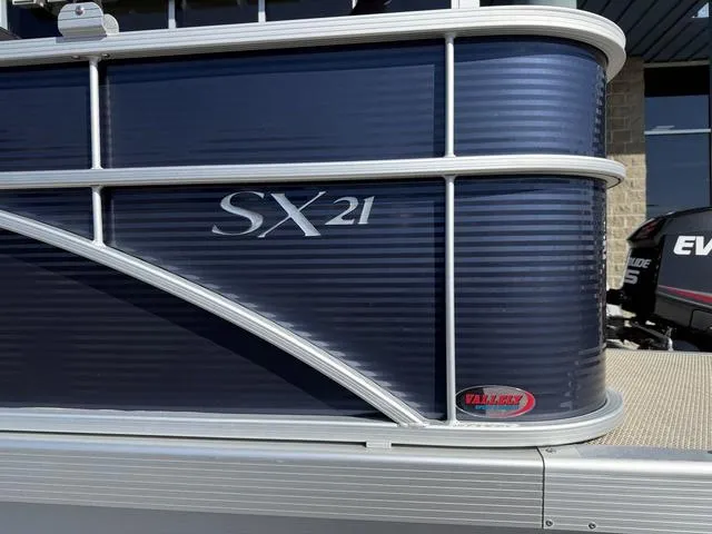 Slide: The Image of 2019 Bennington 21 SSX pontoon boat, blue exterior with SX21 branding. - 5