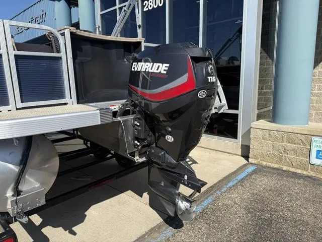 Slide: The Image of 2019 Bennington 21 SSX boat with Evinrude 115 outboard motor displayed outside. - 7