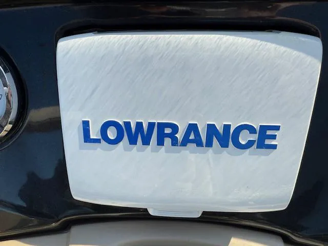 Slide: The Image of Lowrance logo on 2016 Regency 254 DL3 boat dashboard. - 17